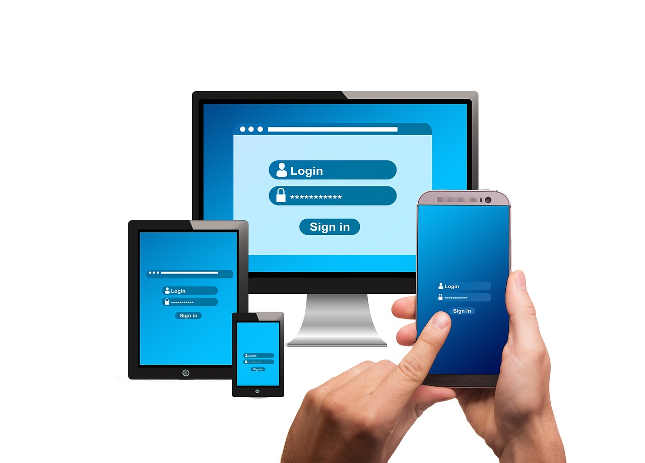 パソコンとスマートフォンでログイン操作をするイメージ